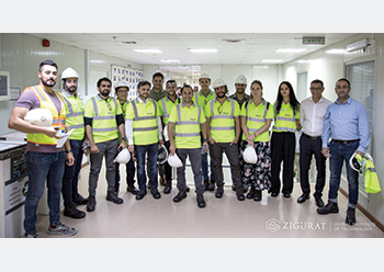 Students who participated in the emplacement at the Midfield Terminal Building with project engineers.