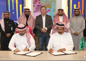 Officials of QIC and Abdul Ali Al Ajmi Company sign the deal.