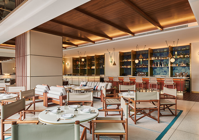 High-gloss walnut and teak furniture add a layer of sophistication at Tapasake.